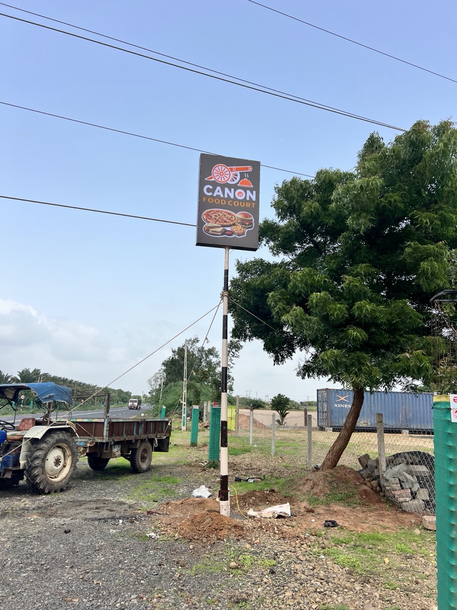 The tall Canon sign by the road